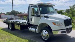 Low Flatbed Towing Service loading=